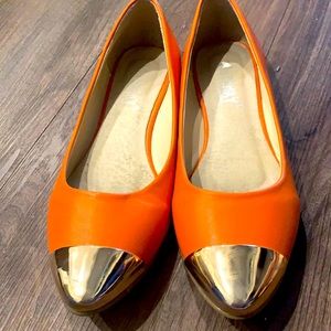Gold tipped orange flats